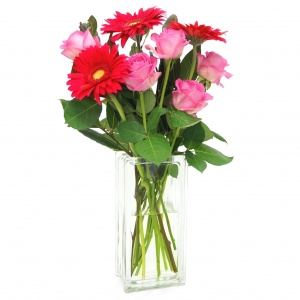 Tall clear glass vase with roses gerbras