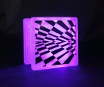 Checkerboard optical illusion decal on glass block LED light