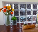 Glass block glass vase with poppies and glass basil herb pot