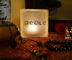 Glass block glass tealight candle holder with peace motif