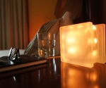 Glass block LED light GloBlock on bedside table