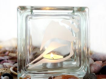 glass tea light candle holder with conch sea shell motif