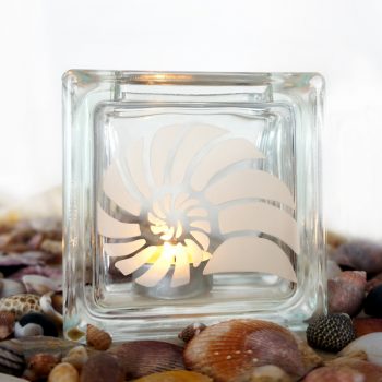 glass tea light candle holder with spiral shell motif