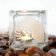 Tea light candle holder with shell motif